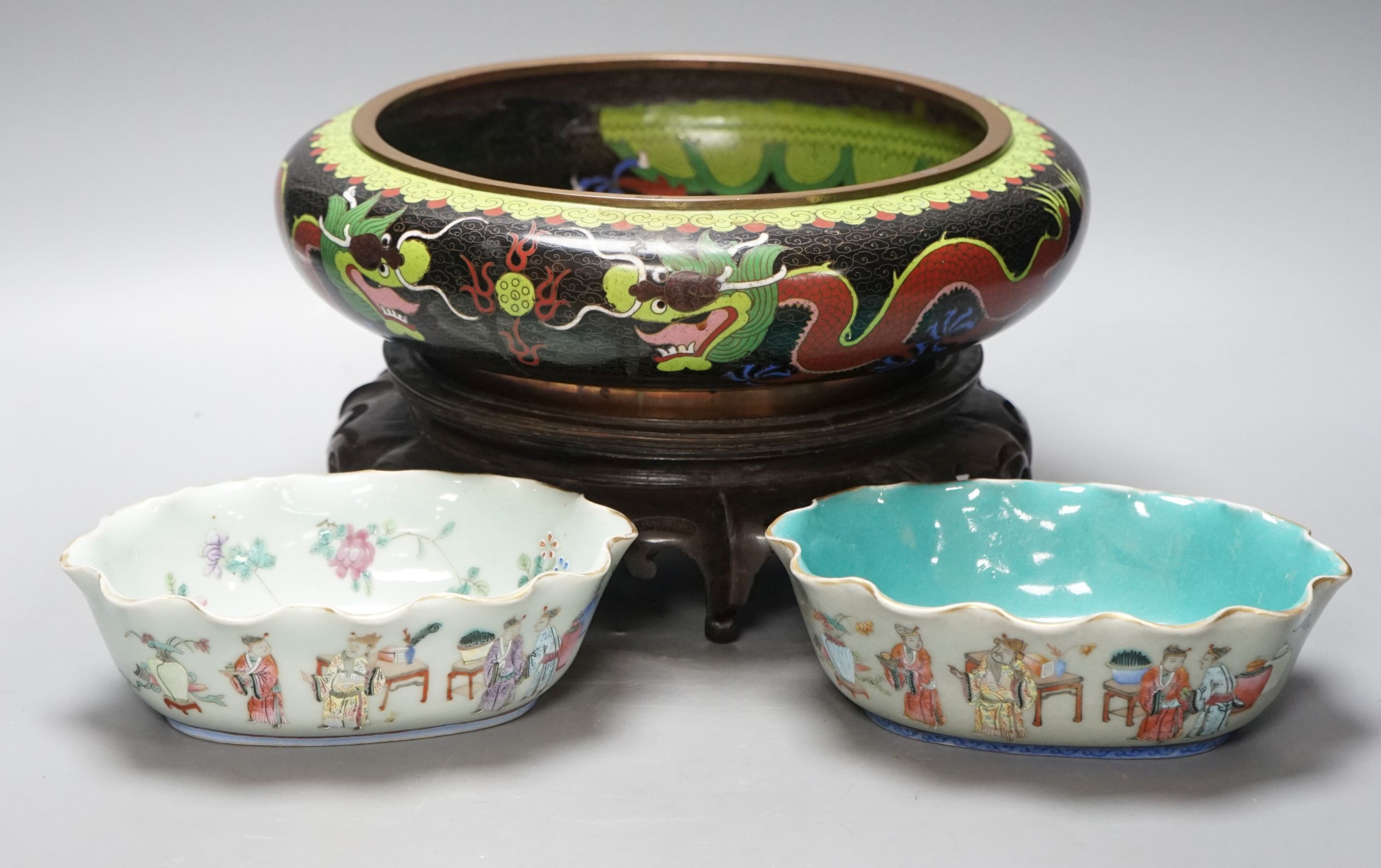 A large early 20th century Chinese cloisonné enamel ‘dragon’ bowl and two Chinese Tongzhi celadon ground famille rose bowls 31cm